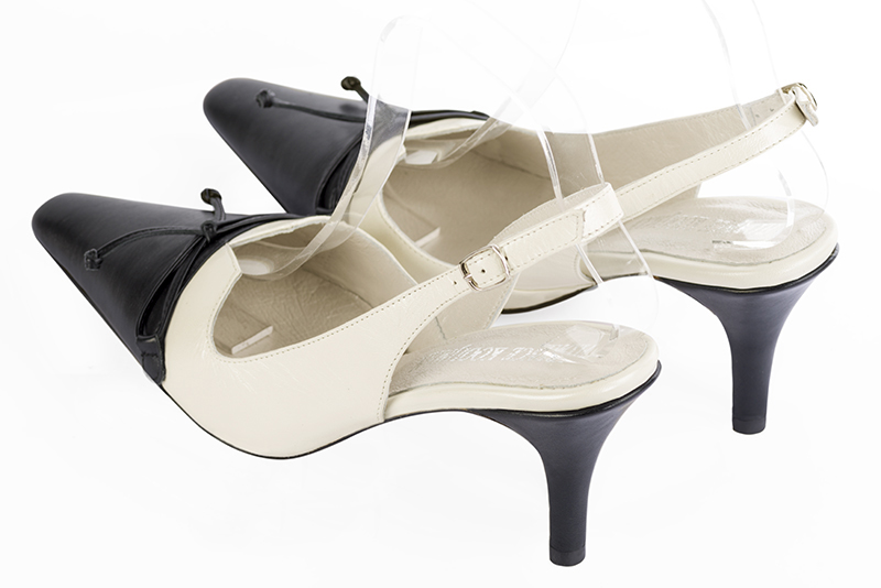 Satin black and off white women's open back shoes, with a knot. Tapered toe. High slim heel. Rear view - Florence KOOIJMAN